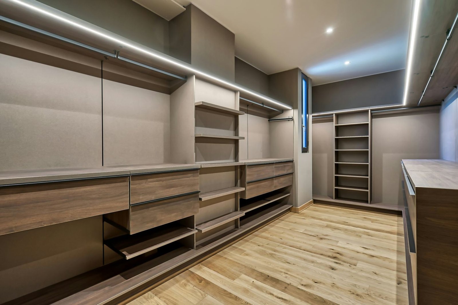 Custom walk-in robe with tailored hanging, shelving and drawers